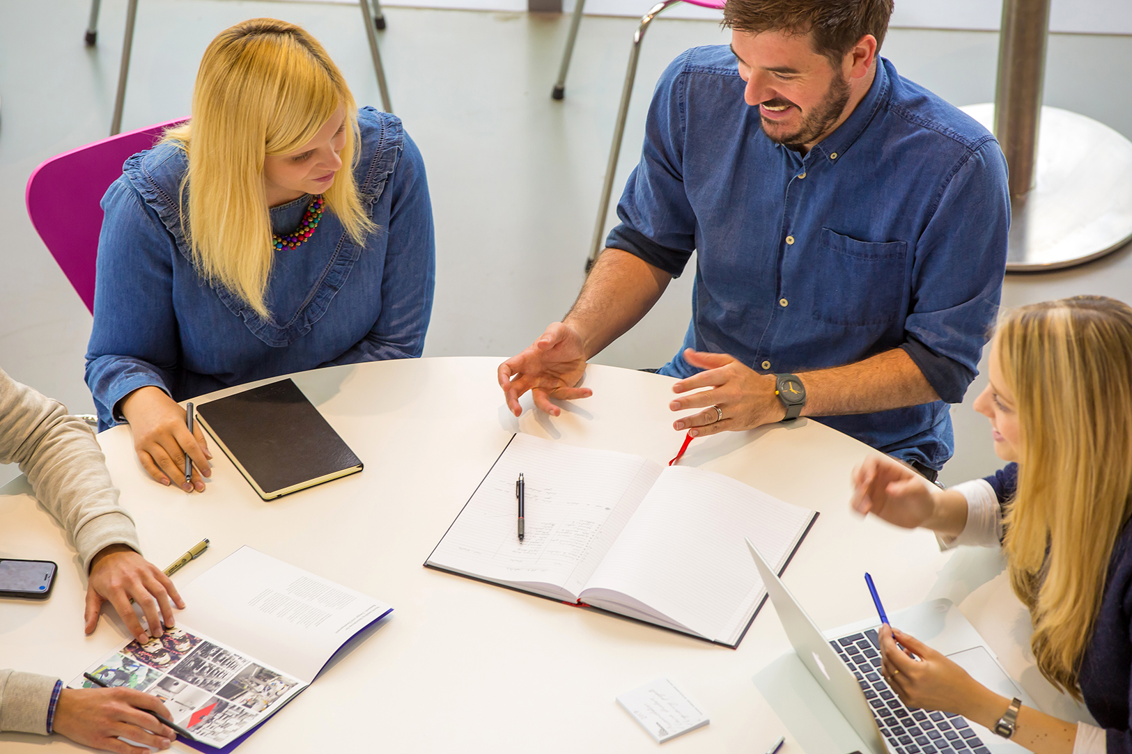 Two graduates chatting on roof terrace Dyson Chicago
